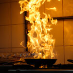 The,Chef,Cooking,And,Makes,A,Fire,In,A,Pan.