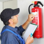 A,Professional,Checking,Afire,Extinguisher