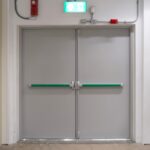 Double,Emergency,Exit,Doors,With,Panic,Bars,And,An,Illuminated