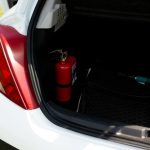 Fire,Extinguisher,In,The,Trunk,Of,A,Car.,Open,Car